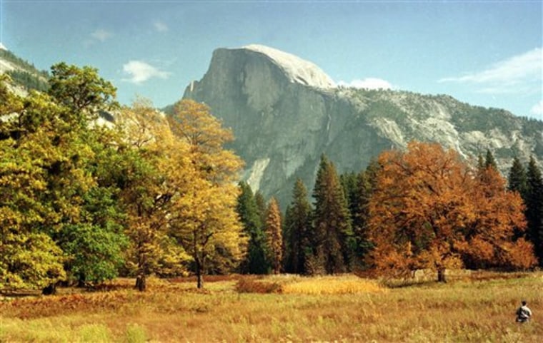FILE - A view of Half Dome from the valley floor of Yosemite National Park is shown in this Oct. 20, 1997 file photo, in Yosemite, Calif. If lawmakers can?t reach an agreement by midnight Friday, April 8, 2011 the Smithsonian and its collection of museums in Washington would close as would Yosemite park in California and other National Parks across the country at a key time for many of the tourist destinations.    (AP Photo/Ben Margot, FIle)